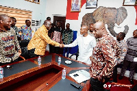 Alan Kyerematen (second left) greets party chair Stephen Ntim