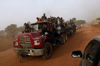 People travelling with coffins to a funeral pictured