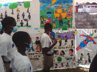 John Wesley Methodist JHS students beside their arts