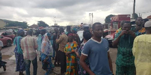 Members of the Wa community protesting recent murders