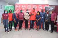 Officials of Absa Bank and Transitions in a group picture