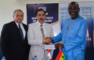 Mr Maher Kheir Presenting A Cheque To Professor Kwamena Kwansah Aidoo.jpeg