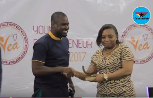 Abeiku Santana receiving his award