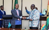 Trade Minister Alan Kyerematen [R] exchanging pleasantries after signing the agreement