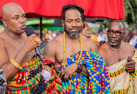 Hezron Clarke (middled) standing before the Otumfuo, other chiefs and elders