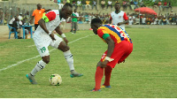 Karela captain, Ampin Dacosta takes on a Hearts player