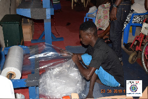 Beneficiaries receiving training in rubber production