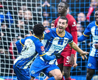 Tariq Lamptey wheels away to celebrate with a teammate