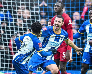 Tariq Lamptey wheels away to celebrate with a teammate