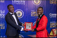 Dr. Lord Emmanuel Yamoah (right) receiving a citation of honour