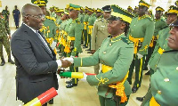 Vice President of Ghana, Dr.Mahamudu Bawumia presenting a citation to some GIS members