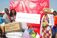 From left: Angela Mensah Poku presenting the cash prize to the Best Female Farmer, Alimatu Boakye