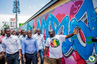 Mayor of Accra, Adjetey Sowah and some officials observing the designs