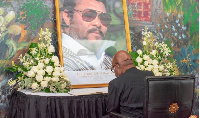 Professor Aaron Mike Oquaye signing the book of condolence