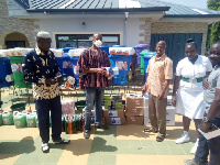 Alhaji Yussif Sulemana presenting the items to the Bole District Health Directorate