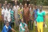 Farmers going through capacity building training on bee keeping in Adonikrom.