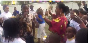 The Second Lady [in white t-shirt behind Funny Face] dances with pupils at the book reading event