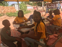 Nurses checking the temperature of the children at the home