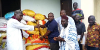 The MP, MCE giving out the items to the Tikobo No.1 Mosque