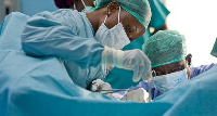 Physicians in a surgical theatre