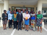 Madam Nora Ollenu (2nd R) and Mr Joseph Obeng-Poku (M) in a group photo with stakeholders