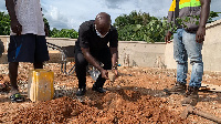 Former Ambassador to China, H.E Edward Boateng, planting a tree