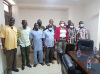 The Minister in a pose with the leadership of the fishermen