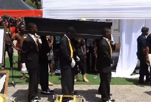 Pall bearers carrying Ebony's casket