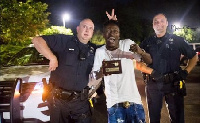 Shatta Wale poses with American policemen