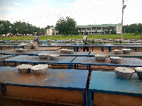 Pantry men preparing the tables for the students