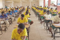 A group of students writing exams