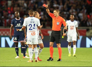 Alexander Djiku Of RC Strasbourg Is Shown A Red Card By Referee Willy Delajod Against PSG 