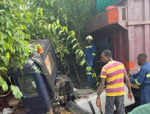 Personnel of GNFS at the scene of the incident working to rescue victims