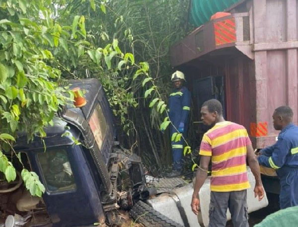 Personnel of GNFS at the scene of the incident working to rescue victims