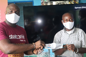 Samuel Quartei Quartey, receiving the facemasks