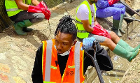 Article Wan helping clean chocked gutters in Dzorwulu