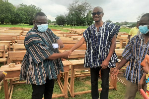 Dr Michael Wombeogo making a presentation of dual desks