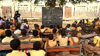 Basic pupils studying under a tree