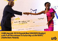 UMB CEO, Mr. Benjamin Amenumey presenting the scholarship to the 2019 overall Best WASSCE Student