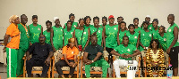 Kurt Okraku seated in the middle with players and officials from Niger