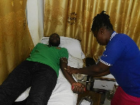 Some member of the union (on bed) as laboratory staff attend to him