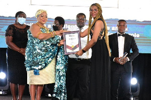 MRS WINIFRED SETOR SMITH  RECEIVES AN AWARD ON BEHALF OF MTN778