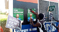 Some of the protesters pasted photos of Mahama at the office