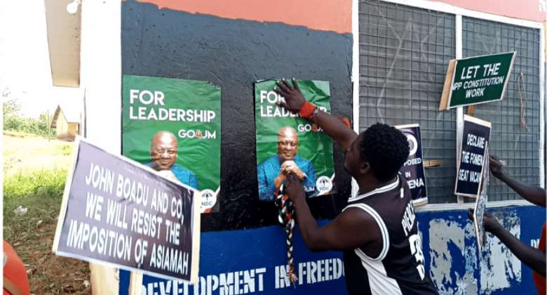 Some of the protesters pasted photos of Mahama at the office