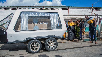 A hearse carrying the remains of Lemekani Nathan Nyirenda at Lusaka's Kenneth Kaunda Airport