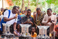 Edem Agbana with his team at one of the schools