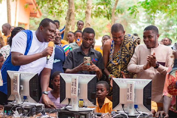 Edem Agbana with his team at one of the schools