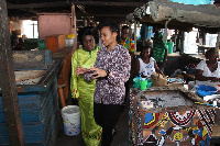 Dr. Zanetor Agyeman-Rawlings touring ovens which produce decreased emissions