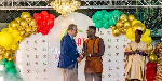 Ghanaian football leged, Asamoah Gyan picking up his award