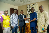 Sports Minister, Mustapha Ussif  presents money to Medeama officials